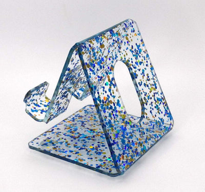 Global Phone Stand in Blue confetti acrylic design, fits most smartphones, durable and easy to clean.