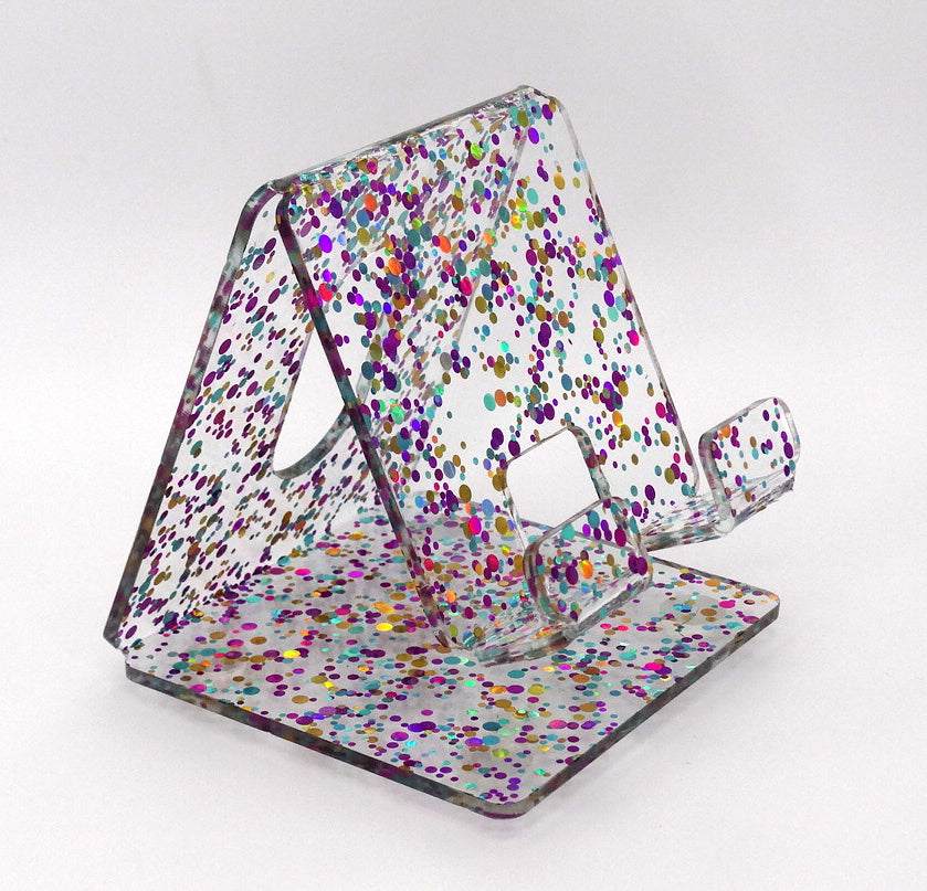 Global Phone Stand Multi Colored confetti-patterned acrylic design, fits most smartphones, durable and easy to maintain.