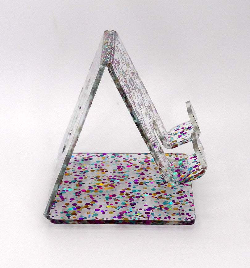 Global Phone Stand Multi Colored confetti-patterned acrylic design, fits most smartphones, durable and easy to maintain.