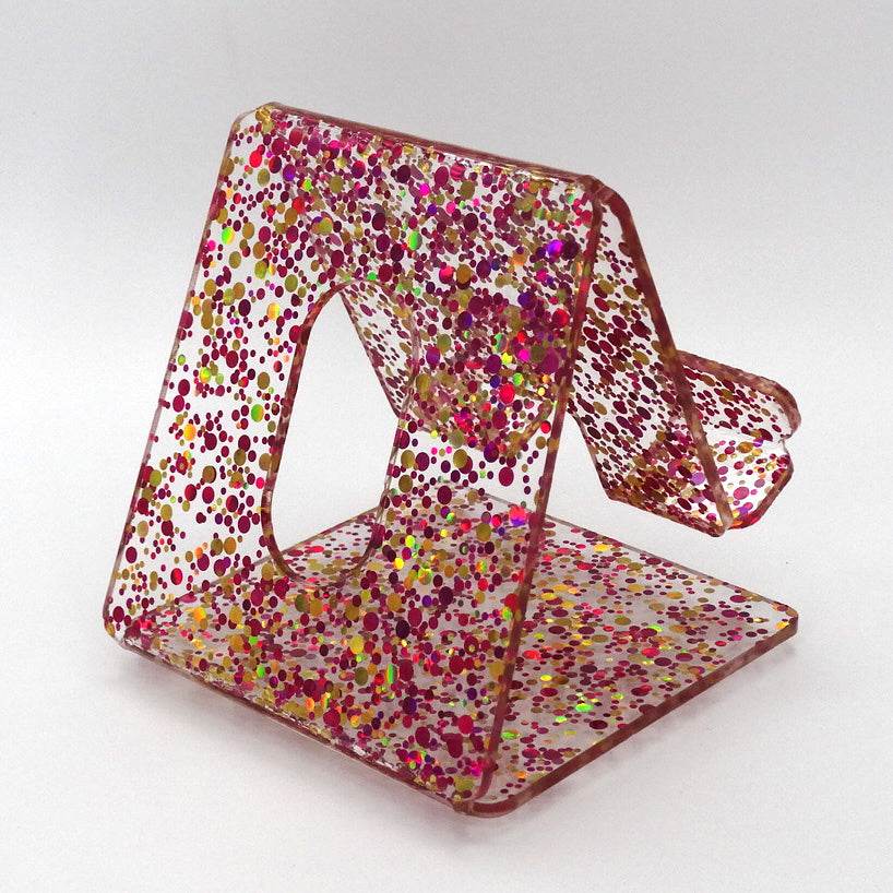 Global Phone Stand Multi Colored confetti-patterned acrylic design, fits most smartphones, durable and easy to maintain.