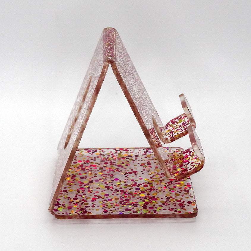 Global Phone Stand Multi Colored confetti-patterned acrylic design, fits most smartphones, durable and easy to maintain.